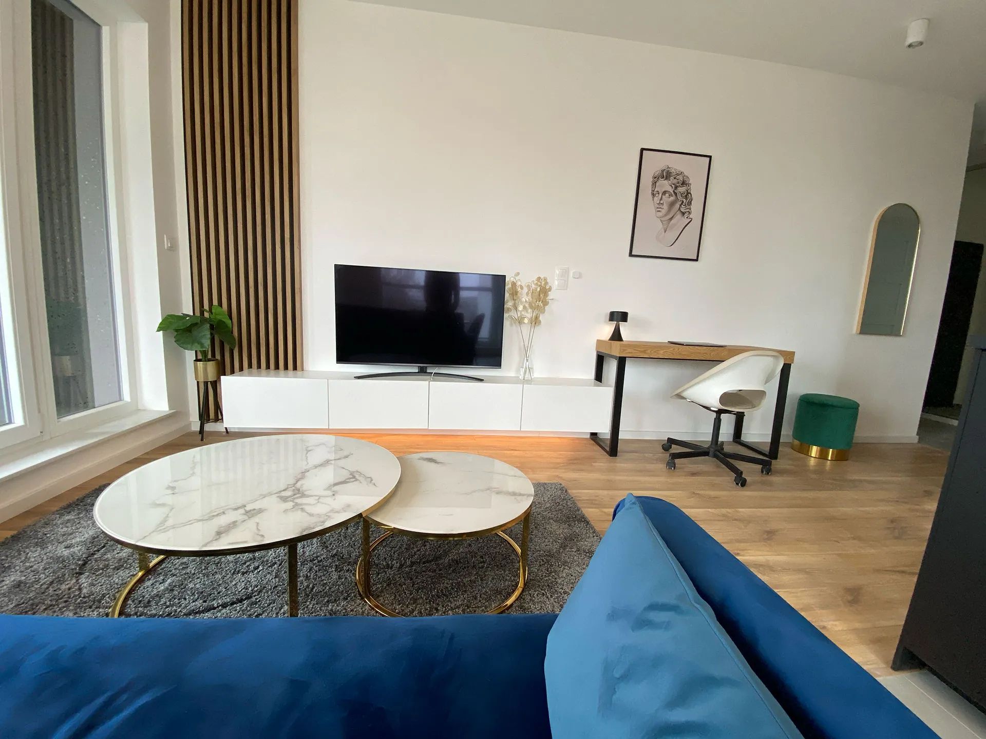 Living room of Apartment S30 with gold accents