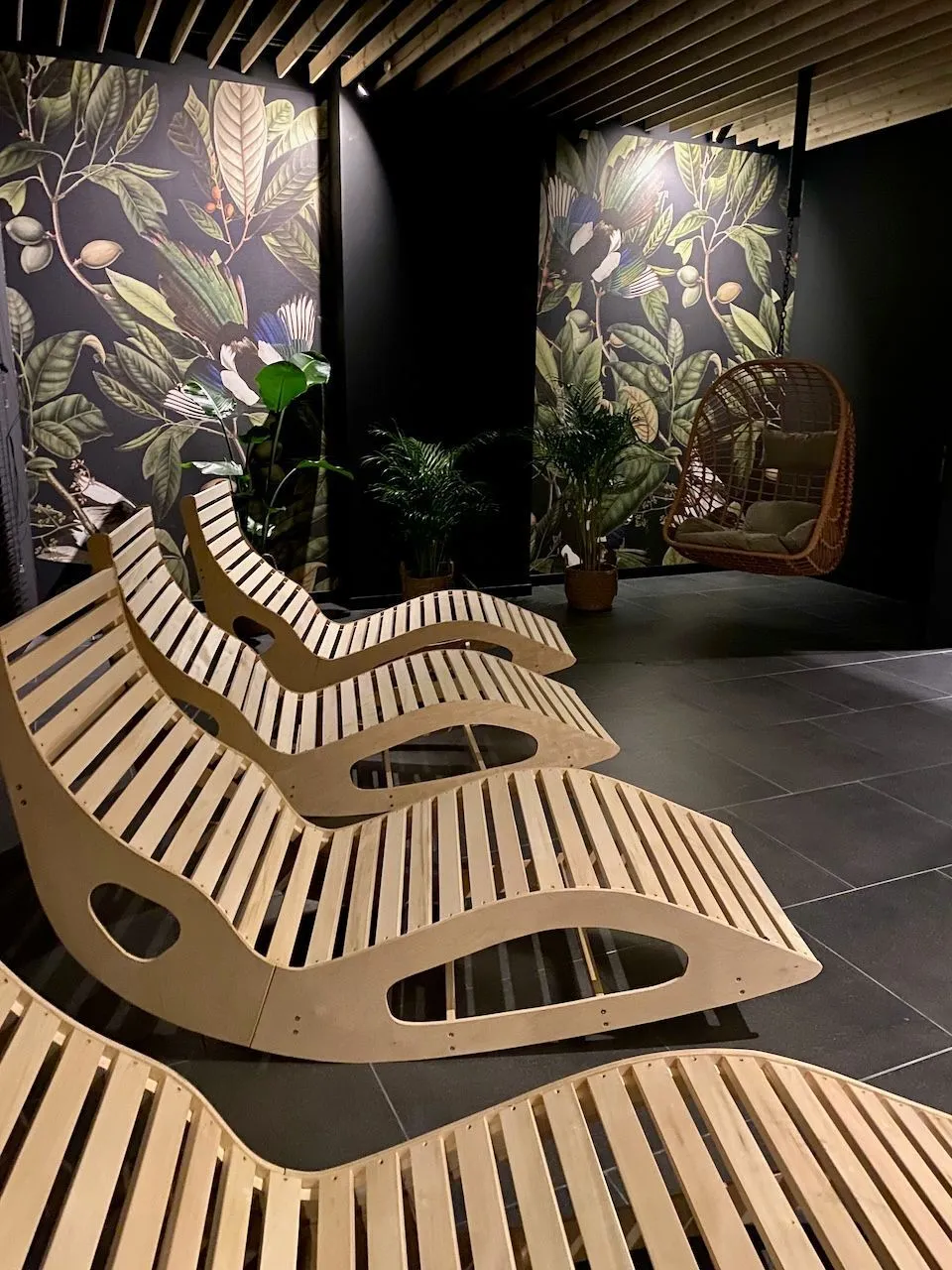 Relaxation zone with wooden loungers in Sokolska 30 Towers